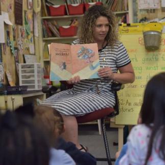 b11-img.jpg Reading to students